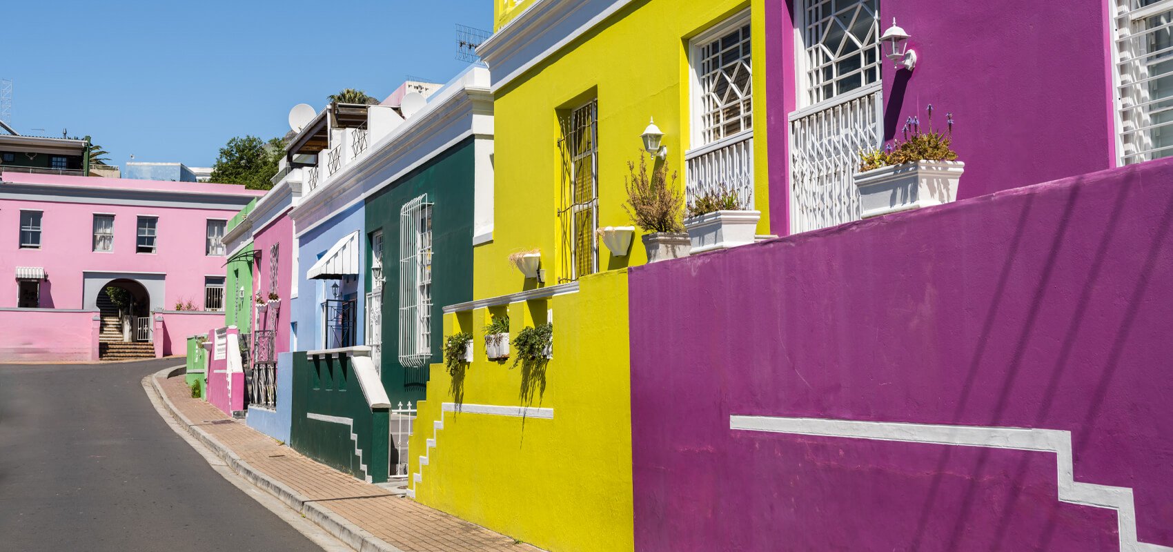 The famously colourful houses lining a cobblestone street in Bo-Kaap