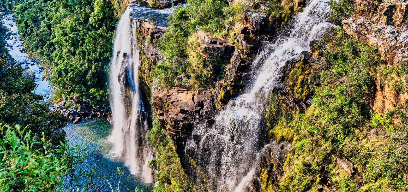 Multiple cascades of Lisbon Falls flowing through green foliage, Panorama Route, Mpumalanga