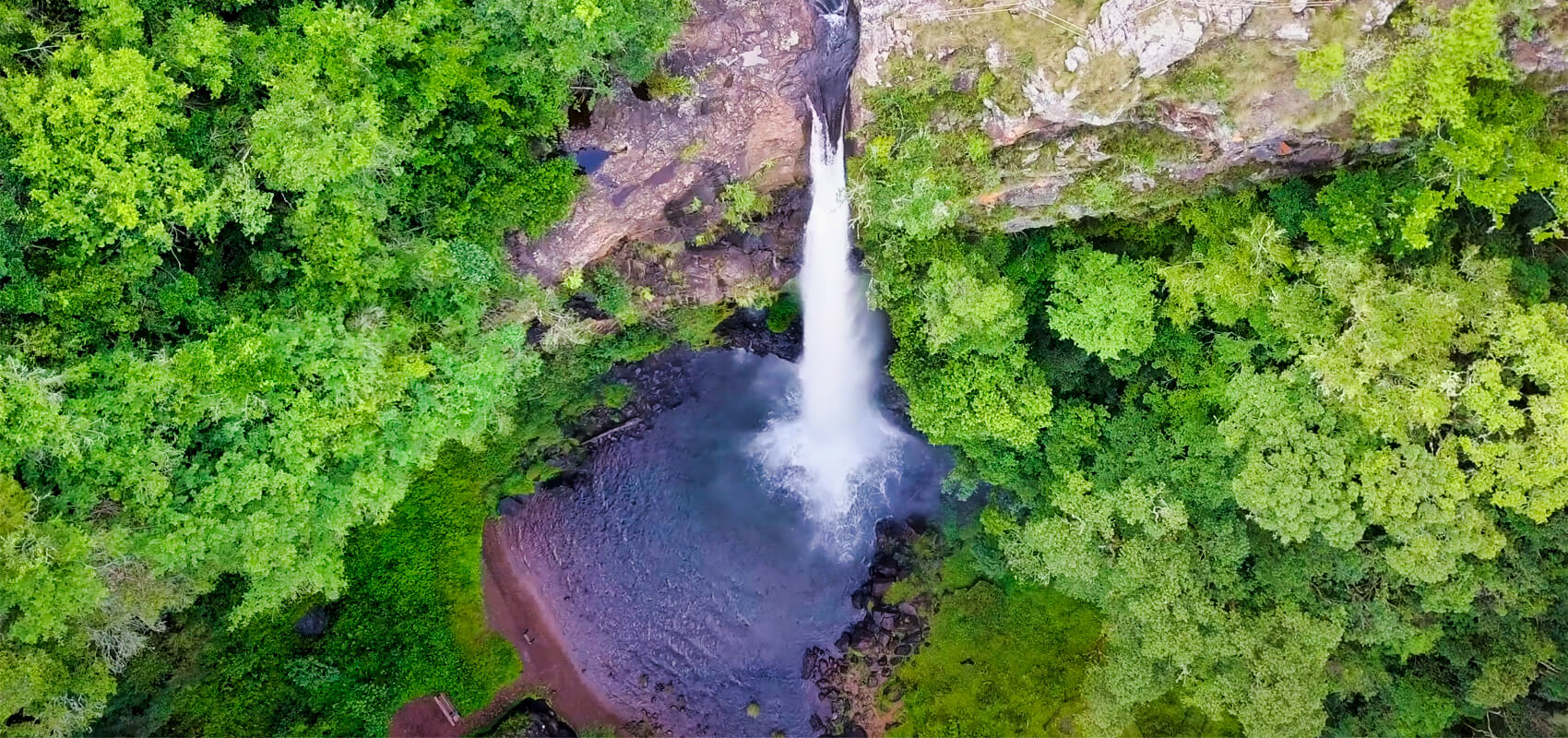 Panorama Route attraction: Lone Creek Falls plunging into tranquil crystal pools near Sabie, Mpumalanga