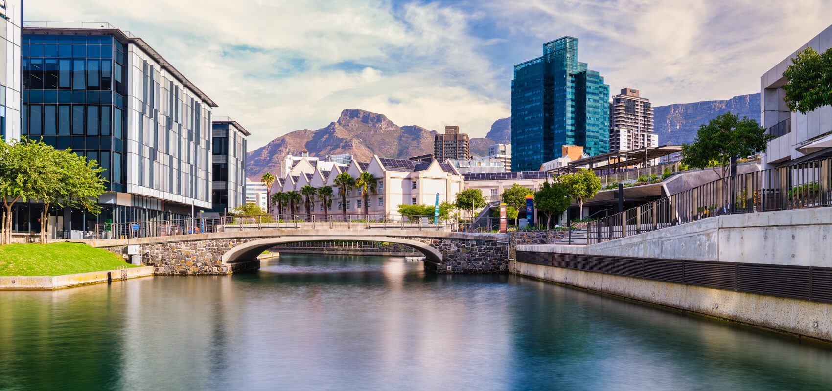 The picturesque V&A Waterfront canal and Cape Town’s skyline in the distance.
